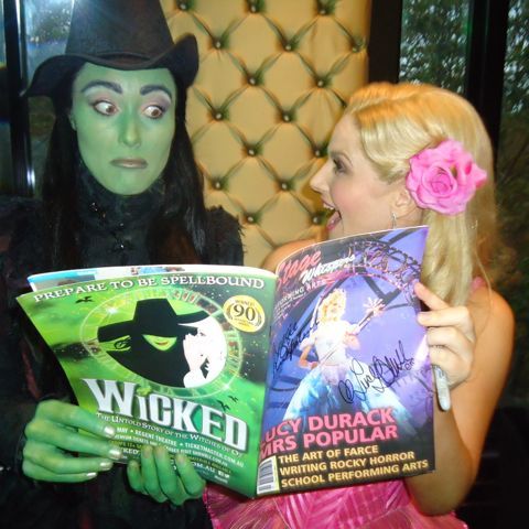 Elphaba (Jemma Rix) and Glinda (Lucy Durack) check out Stage Whispers.